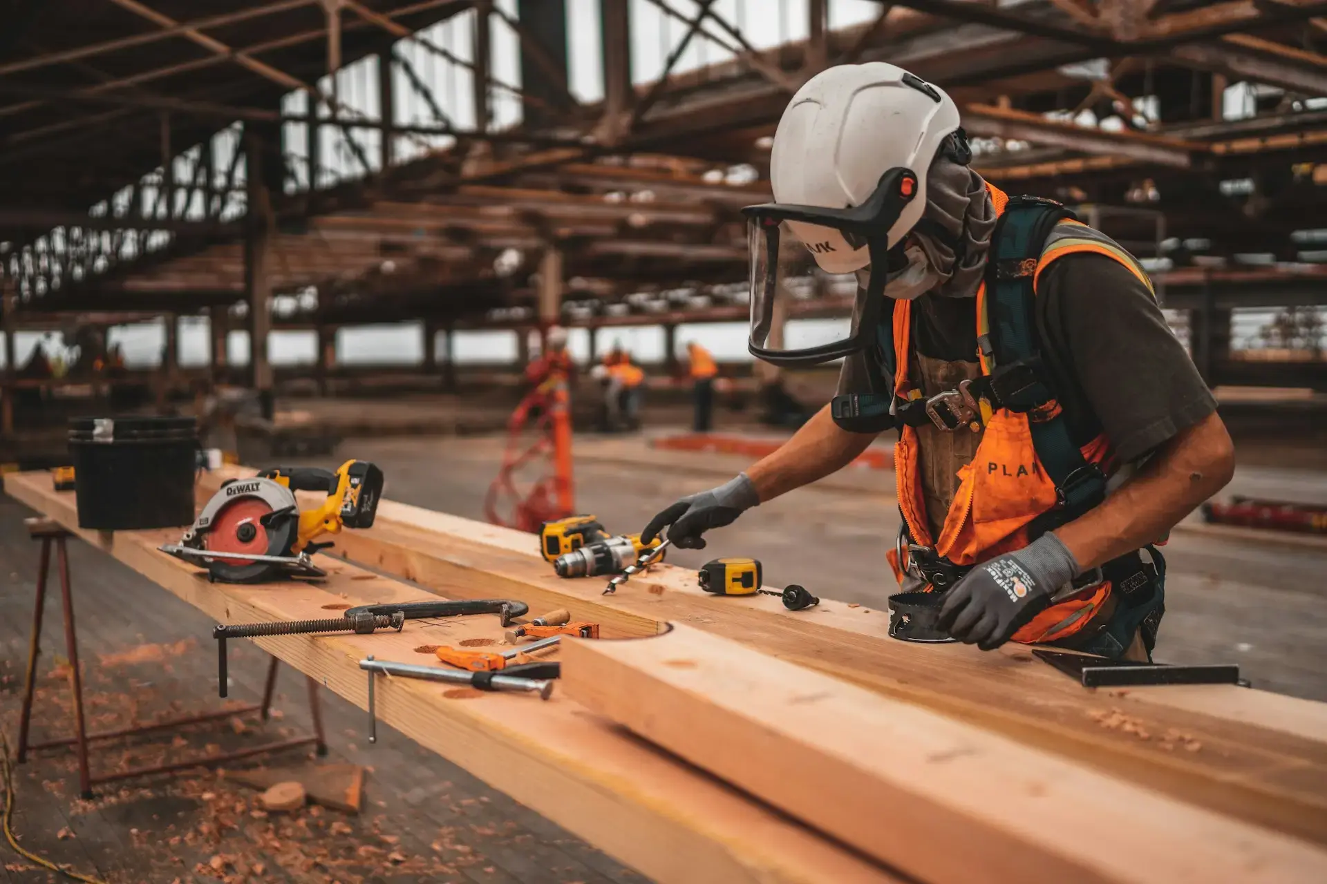 construction worker working with wooden beams