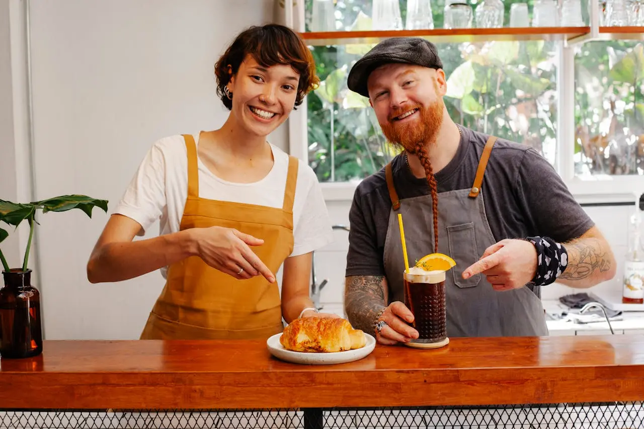 small business restaurant owners posing with their menu items